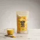 Golden Glow Latte por alakú ital csomagolása a The Botanist márkától, 250g kiszerelésben